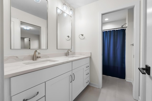 8114 Turning Stone, Kalamazoo, MI 49009 - bathroom featuring double vanity, a sink, baseboards, and tile patterned flooring