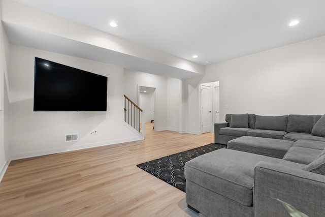 8114 Turning Stone, Kalamazoo, MI 49009 - living area featuring stairs, wood finished floors, baseboards, visible vents, and recessed lighting