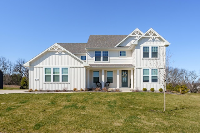 8114 Turning Stone, Kalamazoo, MI 49009 - view of front of home with board and batten siding, a shingled roof, and a front lawn