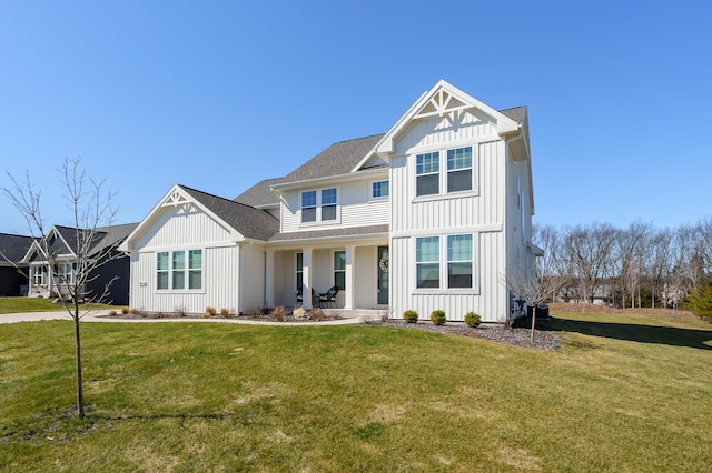 8114 Turning Stone, Kalamazoo, MI 49009 - view of front of house with board and batten siding and a front yard