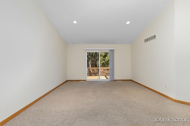 7588 Rivendell Dr SE, Grand Rapids, MI 49508 - unfurnished room featuring vaulted ceiling, recessed lighting, carpet flooring, baseboards, and visible vents
