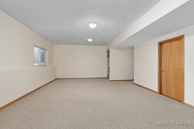 7588 Rivendell Dr SE, Grand Rapids, MI 49508 - empty room with baseboards and light colored carpet