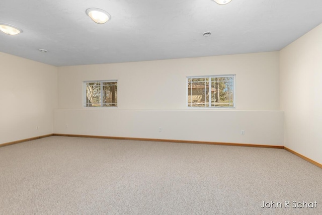 7588 Rivendell Dr SE, Grand Rapids, MI 49508 - carpeted spare room with baseboards