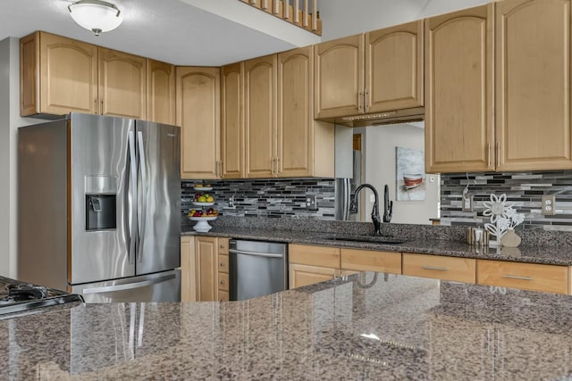 11262 Lemott Cir, Jerome, MI 49249 - kitchen featuring dark stone countertops, a sink, stainless steel fridge with ice dispenser, backsplash, and light brown cabinetry