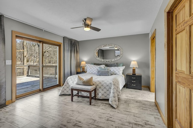 11262 Lemott Cir, Jerome, MI 49249 - bedroom with baseboards, access to outside, light wood finished floors, and ceiling fan