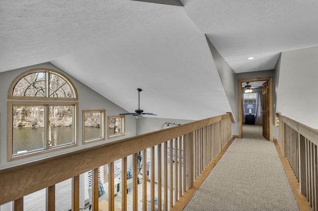11262 Lemott Cir, Jerome, MI 49249 - hall featuring baseboards, lofted ceiling, a textured ceiling, and recessed lighting