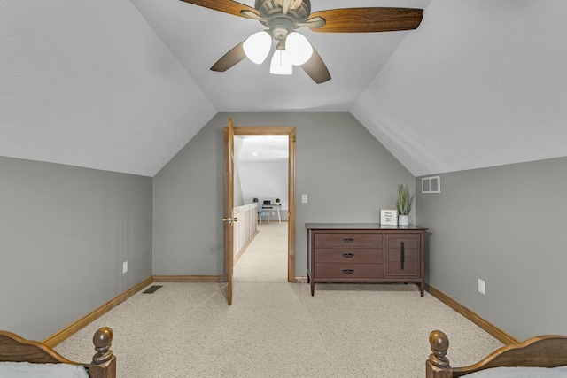 11262 Lemott Cir, Jerome, MI 49249 - interior space featuring baseboards, visible vents, vaulted ceiling, and light colored carpet