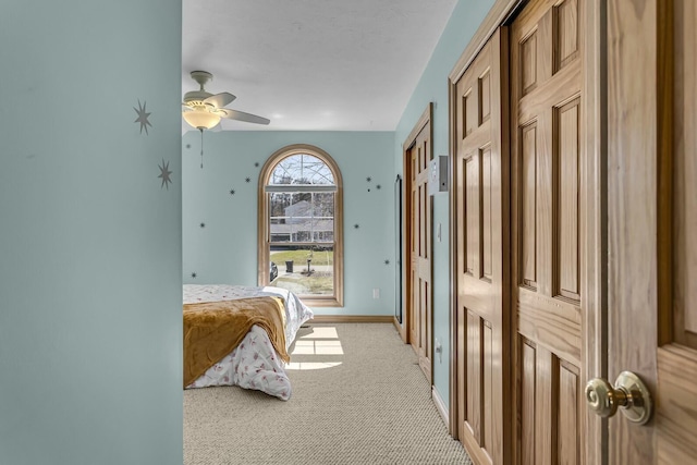 11262 Lemott Cir, Jerome, MI 49249 - bedroom featuring light carpet, baseboards, and a ceiling fan