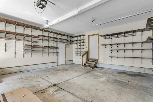 11262 Lemott Cir, Jerome, MI 49249 - garage featuring a garage door opener