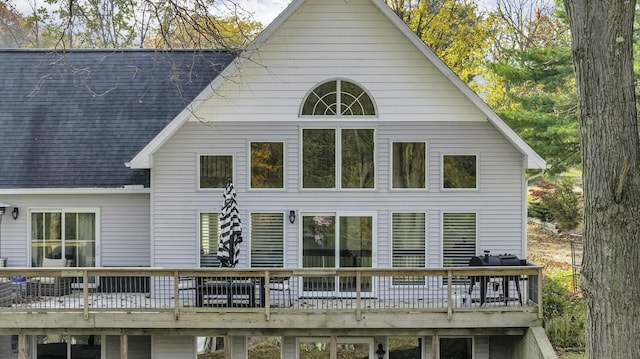 11262 Lemott Cir, Jerome, MI 49249 - back of house with a wooden deck and roof with shingles