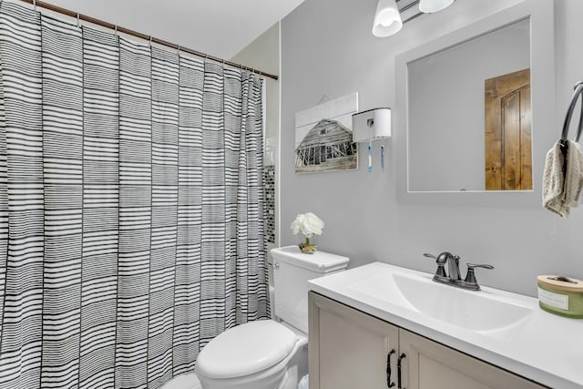 full bath featuring toilet, a shower with shower curtain, and vanity