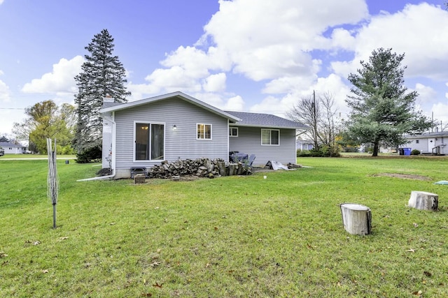 back of property featuring a yard and a chimney