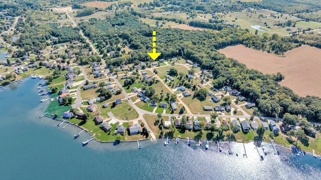 bird's eye view with a residential view and a water view