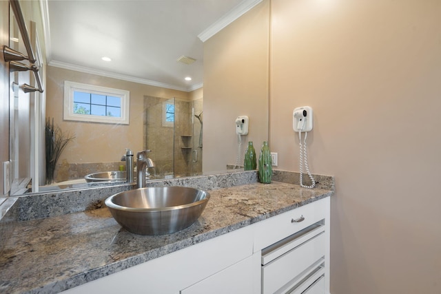 bathroom featuring crown molding, tiled shower, vanity, visible vents, and recessed lighting