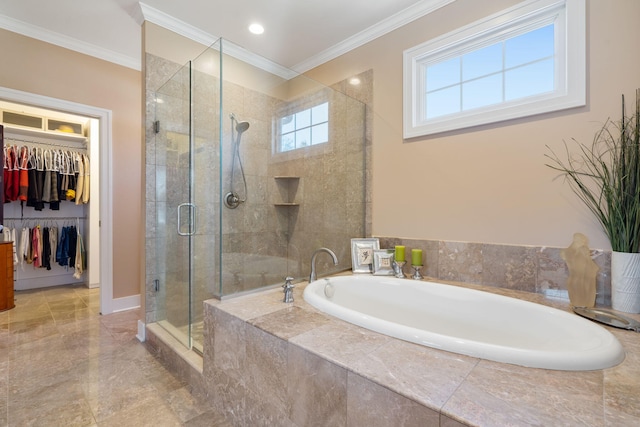 bathroom featuring a spacious closet, ornamental molding, baseboards, a shower stall, and a bath