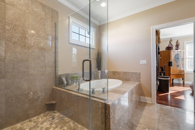 full bathroom with plenty of natural light, a stall shower, and crown molding
