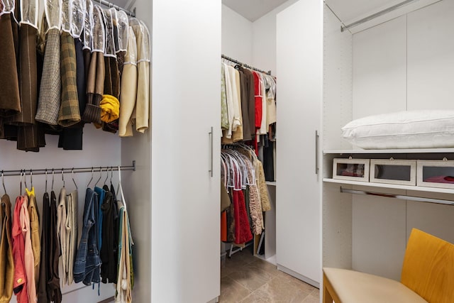 spacious closet with tile patterned flooring