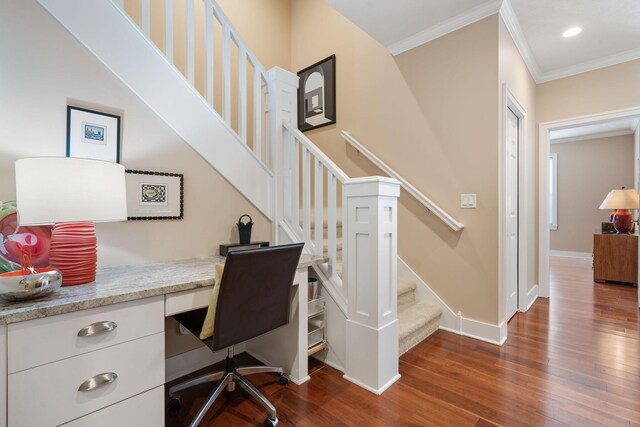 office featuring crown molding, dark wood-style floors, baseboards, built in desk, and recessed lighting