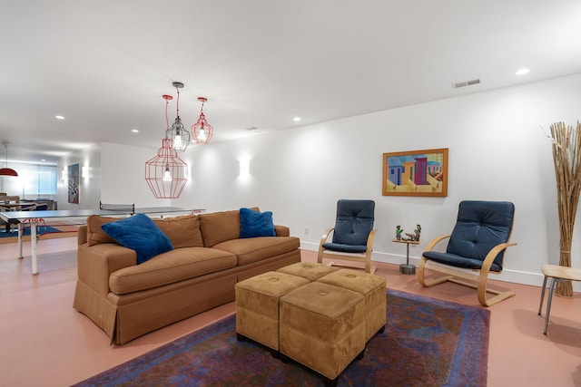 living area featuring recessed lighting, baseboards, and visible vents