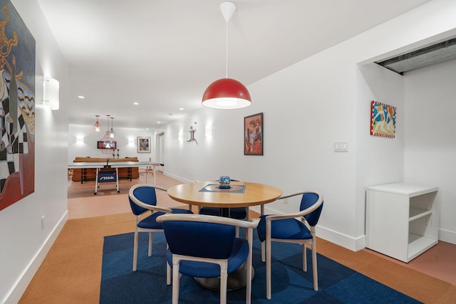 dining area featuring baseboards and recessed lighting