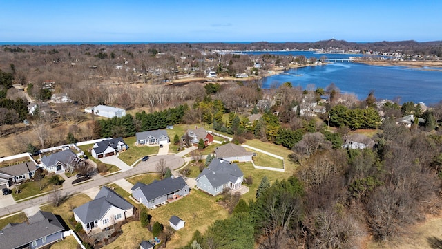 drone / aerial view featuring a water view and a residential view