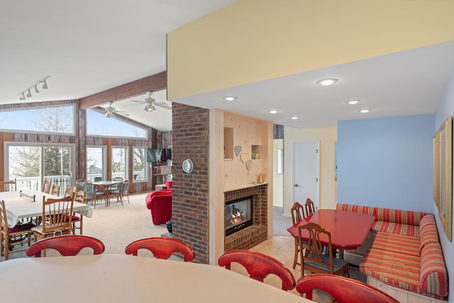 4103 Lake Shore Dr, New Buffalo, MI 49117 - living area featuring carpet flooring, a brick fireplace, a ceiling fan, and vaulted ceiling with beams