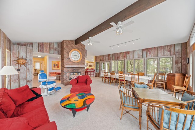 4103 Lake Shore Dr, New Buffalo, MI 49117 - living room featuring wooden walls, a brick fireplace, and a ceiling fan