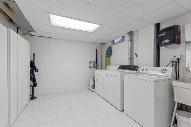 4103 Lake Shore Dr, New Buffalo, MI 49117 - washroom featuring washer and clothes dryer, light floors, laundry area, visible vents, and concrete block wall