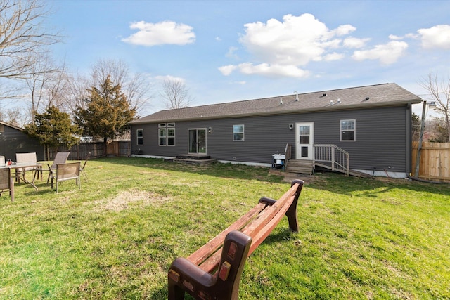 19372 M 140, South Haven, MI 49090 - rear view of property with a lawn and fence