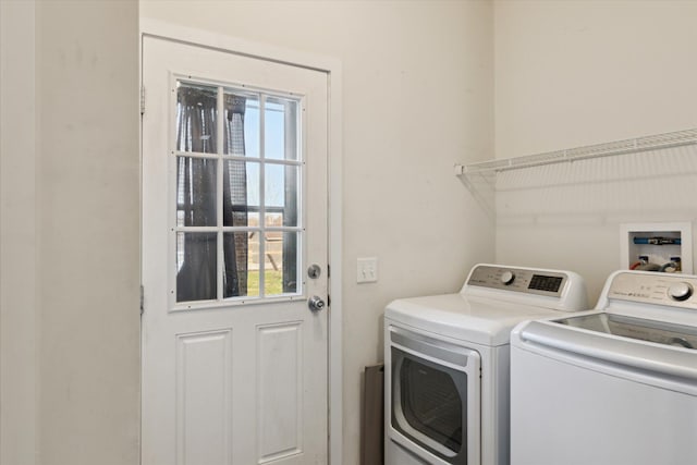 19372 M 140, South Haven, MI 49090 - laundry room with washing machine and clothes dryer, a healthy amount of sunlight, and laundry area