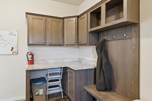 19372 M 140, South Haven, MI 49090 - kitchen featuring baseboards, built in study area, light countertops, and open shelves