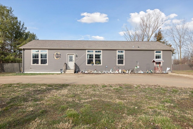 19372 M 140, South Haven, MI 49090 - view of front of home featuring driveway, fence, and a front lawn