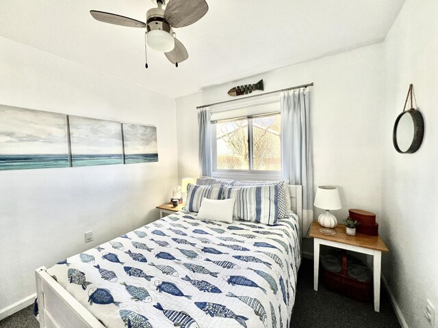 bedroom with baseboards, ceiling fan, and carpet
