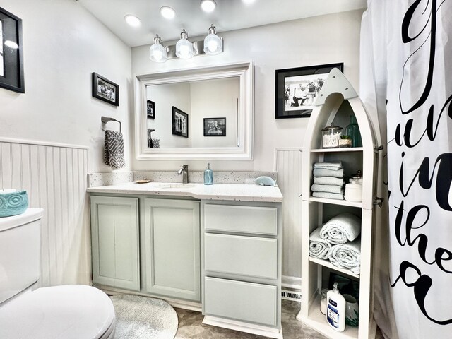 bathroom with toilet and vanity