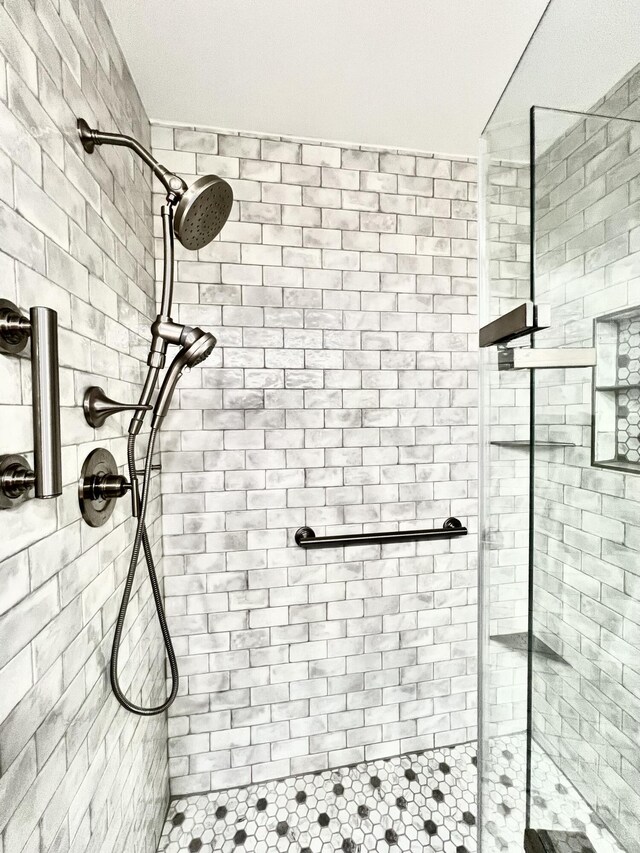 bathroom with a shower stall
