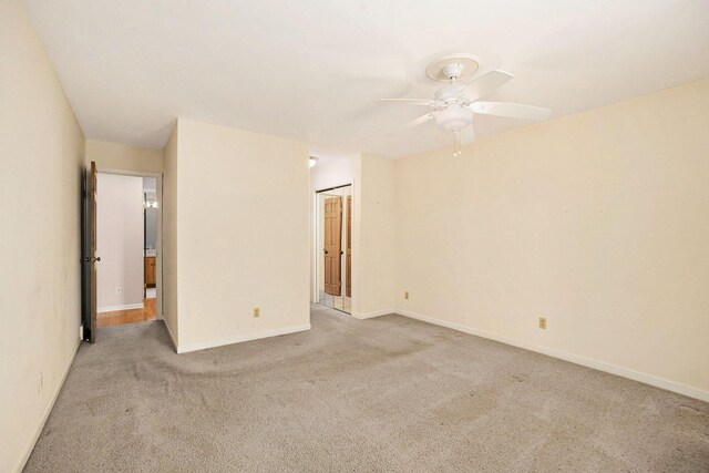 17650 Woodbridge Rd # 1, Spring Lake, MI 49456 - empty room with light colored carpet, a ceiling fan, and baseboards