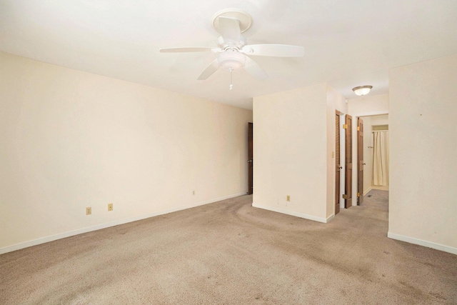 17650 Woodbridge Rd # 1, Spring Lake, MI 49456 - spare room with carpet floors, ceiling fan, and baseboards