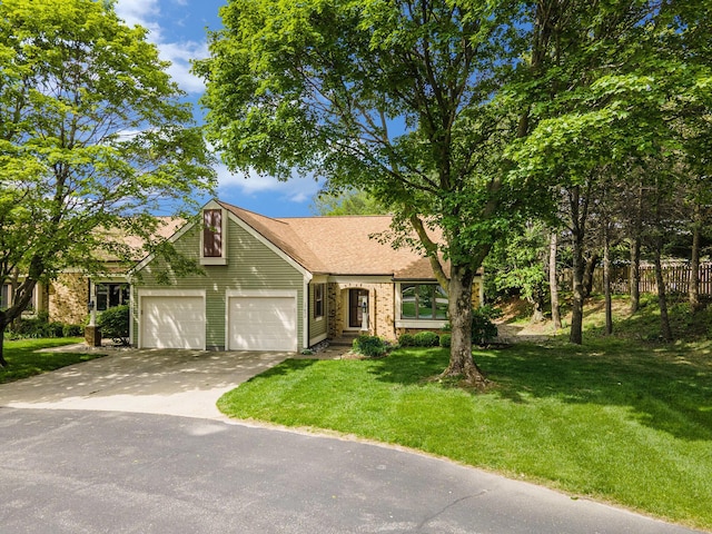 17650 Woodbridge Rd # 1, Spring Lake, MI 49456 - view of front of property with concrete driveway, an attached garage, and a shingled roof