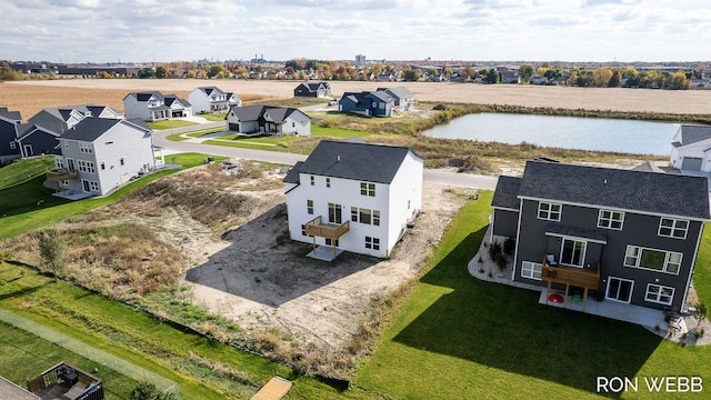 bird's eye view with a water view and a residential view