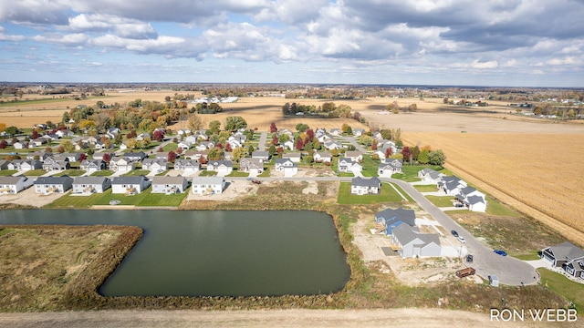 drone / aerial view with a residential view and a water view