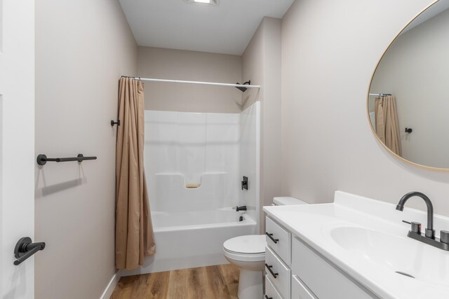 2084 W Fenwick Rd, Fenwick, MI 48834 - full bath with toilet, vanity, shower / tub combo with curtain, and wood finished floors