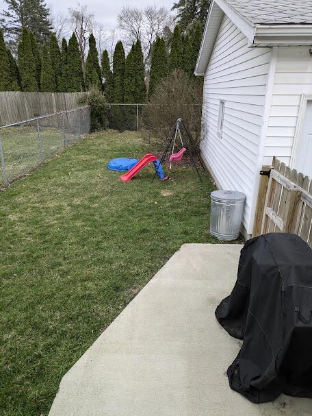 711 Randolph St, Jackson, MI 49203 - view of yard featuring a patio