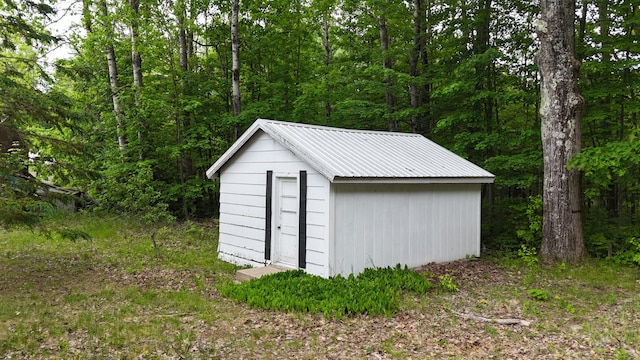 6780 N High Bridge Rd, Brethren, MI 49619 - view of shed with a wooded view