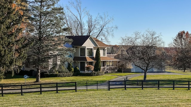 7295 Dutch Rd, Goodrich Vlg, MI 48438 - view of front of house featuring a fenced front yard and a front lawn