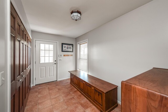 7295 Dutch Rd, Goodrich Vlg, MI 48438 - mudroom with baseboards and light tile patterned floors