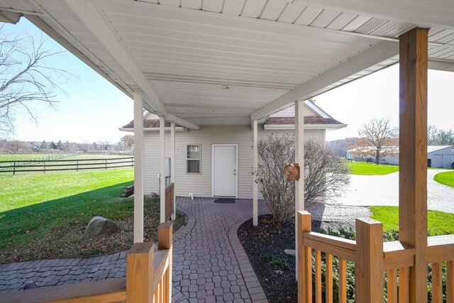 7295 Dutch Rd, Goodrich Vlg, MI 48438 - view of patio featuring fence and a rural view
