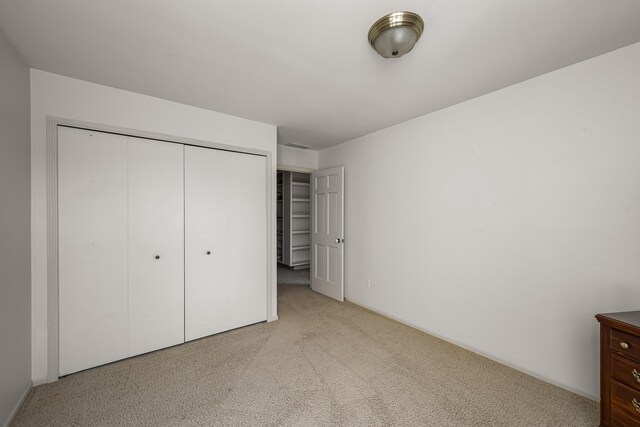 7295 Dutch Rd, Goodrich Vlg, MI 48438 - unfurnished bedroom featuring a closet and carpet floors