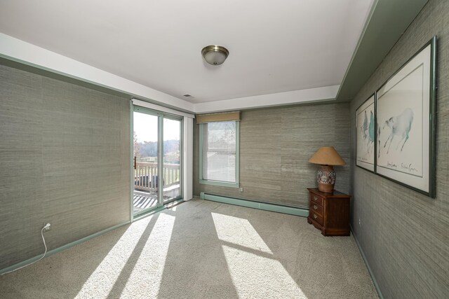7295 Dutch Rd, Goodrich Vlg, MI 48438 - empty room with a baseboard heating unit and carpet