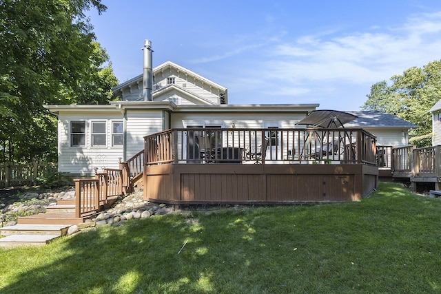 320 N Division St, Marshall, MI 49068 - rear view of property featuring stairs, a wooden deck, and a lawn