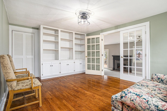 320 N Division St, Marshall, MI 49068 - bedroom with dark wood-style flooring and french doors